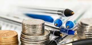 Coins, pens and financial documents